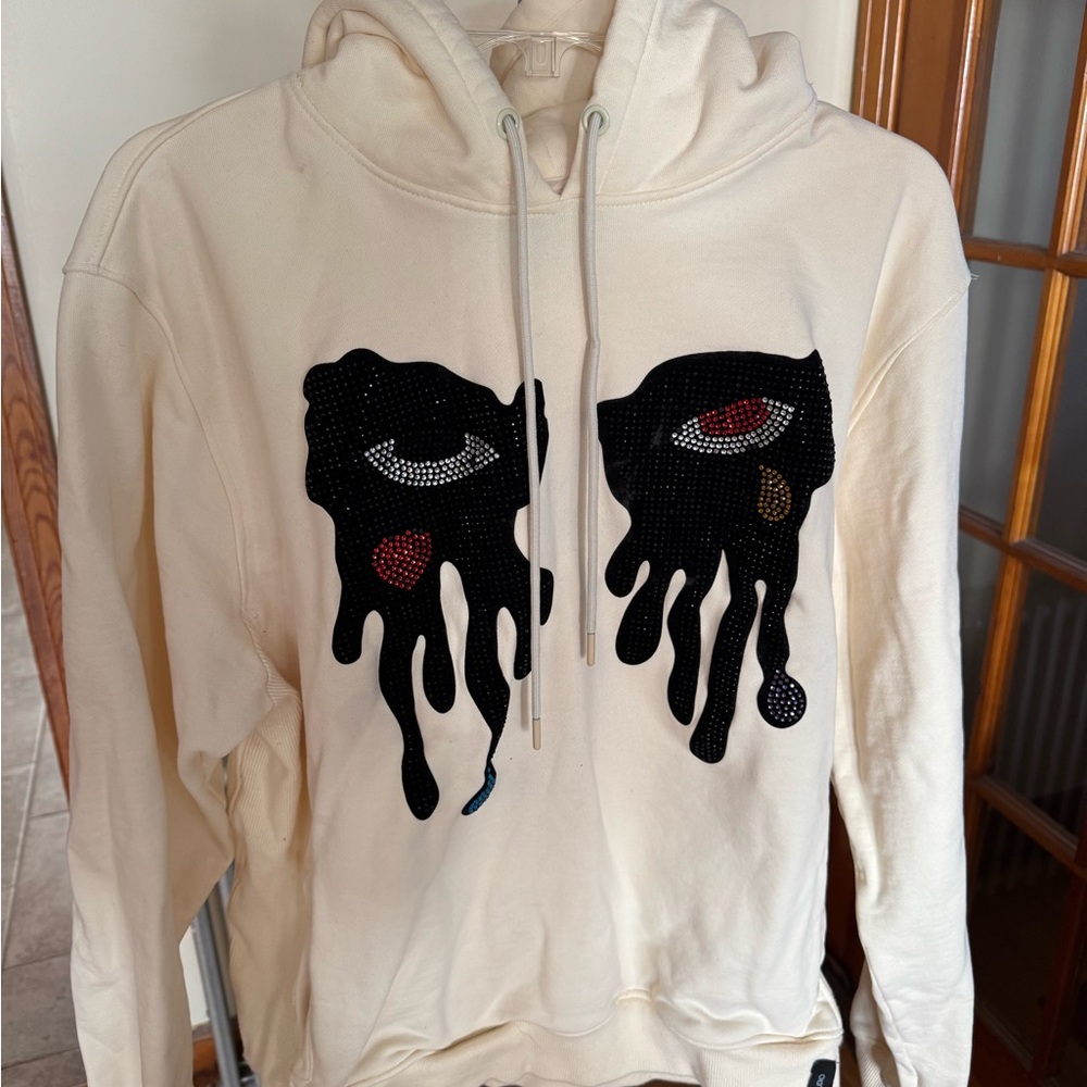 Cream Hoodie with Dripping Eyes Design